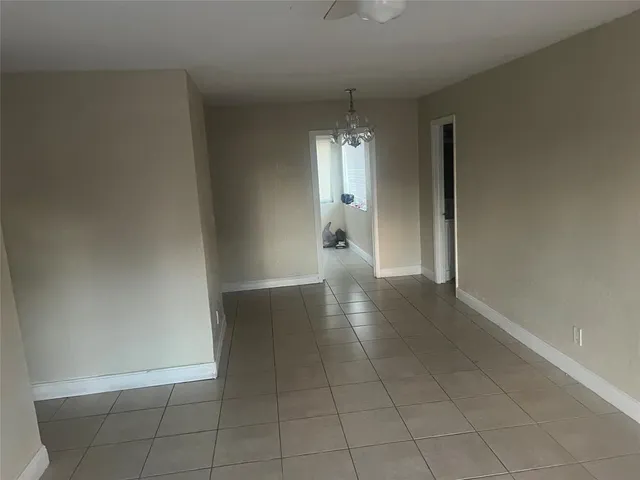 wooden floor in an empty room and a window