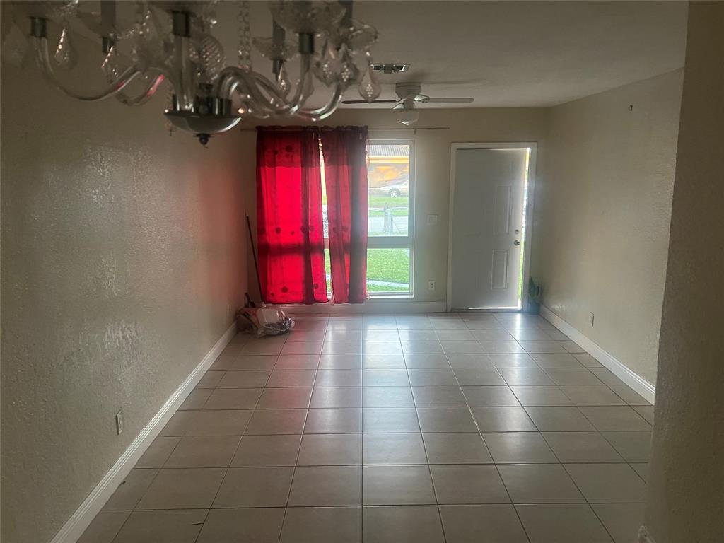 1451 Northwest 33rd Avenue Lauderhill, FL 33311 - Photo 8 of 13 a view of gallery with wooden floor