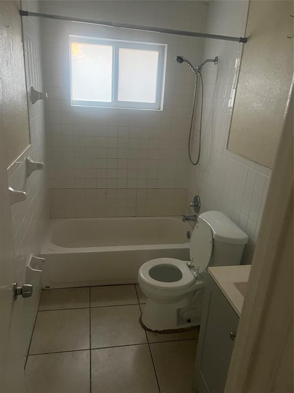 1451 Northwest 33rd Avenue Lauderhill, FL 33311 - Photo 10 of 13 a bathroom with a sink a toilet and shower