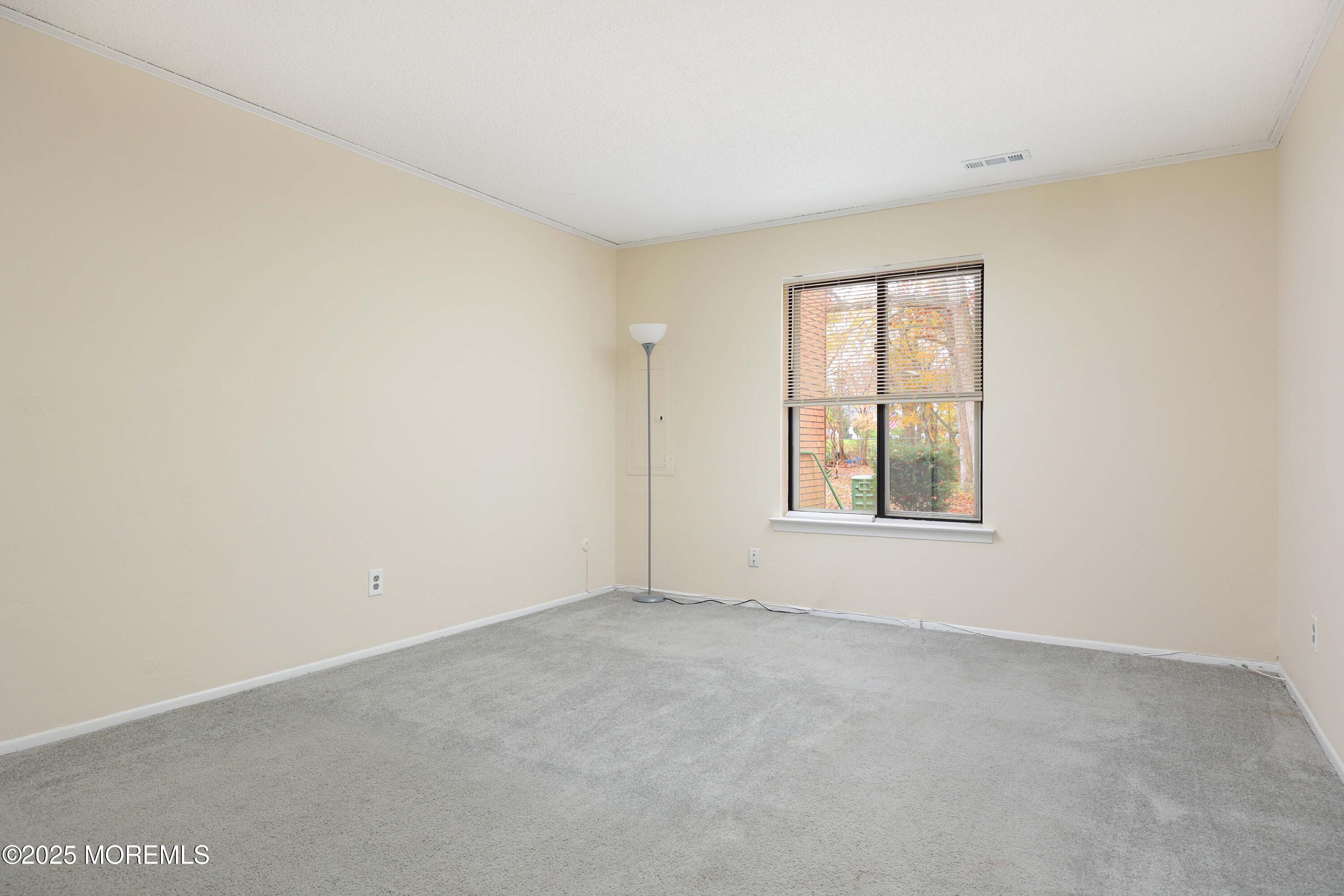 89 Northrup Drive, Unit 75 Brick, NJ 08724 - Photo 15 of 22 an empty room with windows