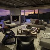 a living room with furniture a lamp and a fireplace