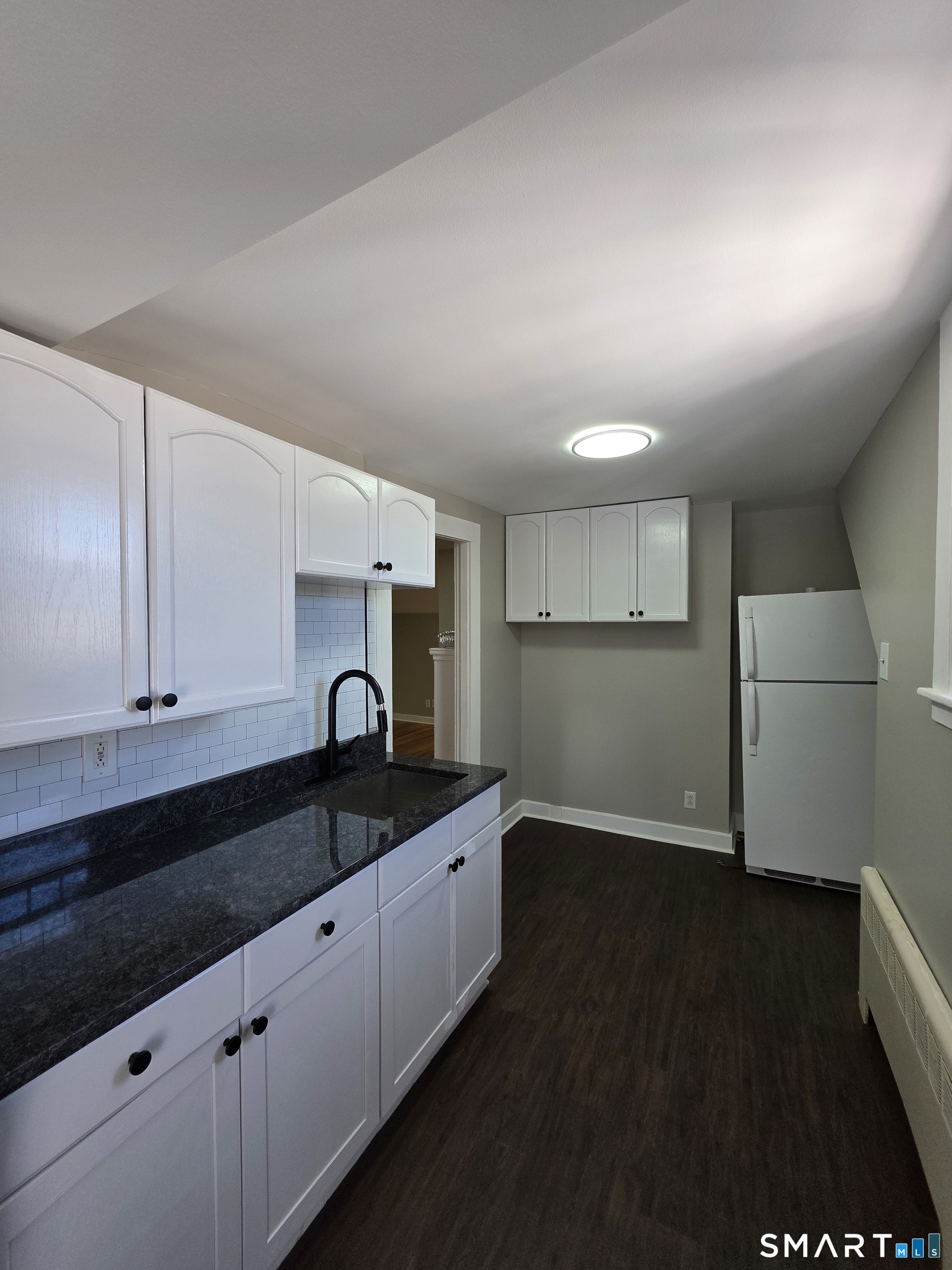 396 West Main Street, Unit 3 New Britain, CT 06052 - Photo 1 of 17 a kitchen with granite countertop a sink and a stove top oven