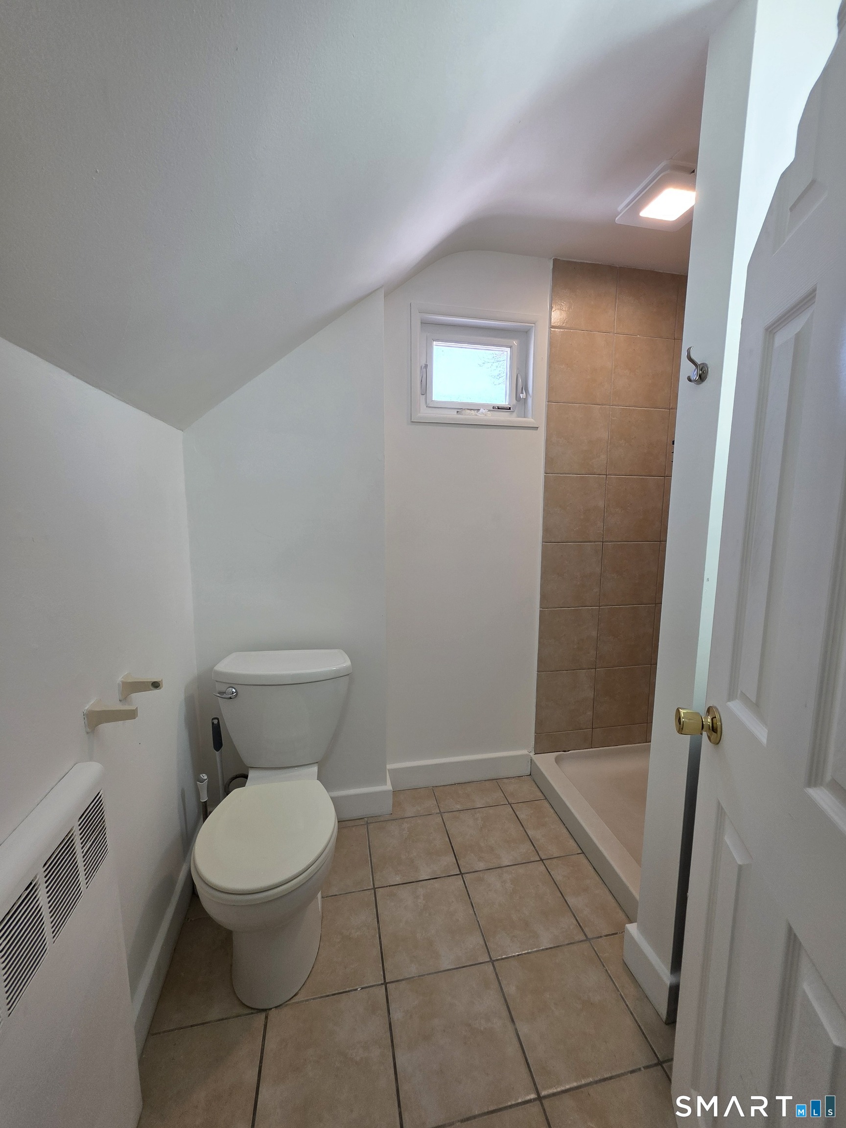 396 West Main Street, Unit 3 New Britain, CT 06052 - Photo 12 of 17 a white toilet sitting next to a shower