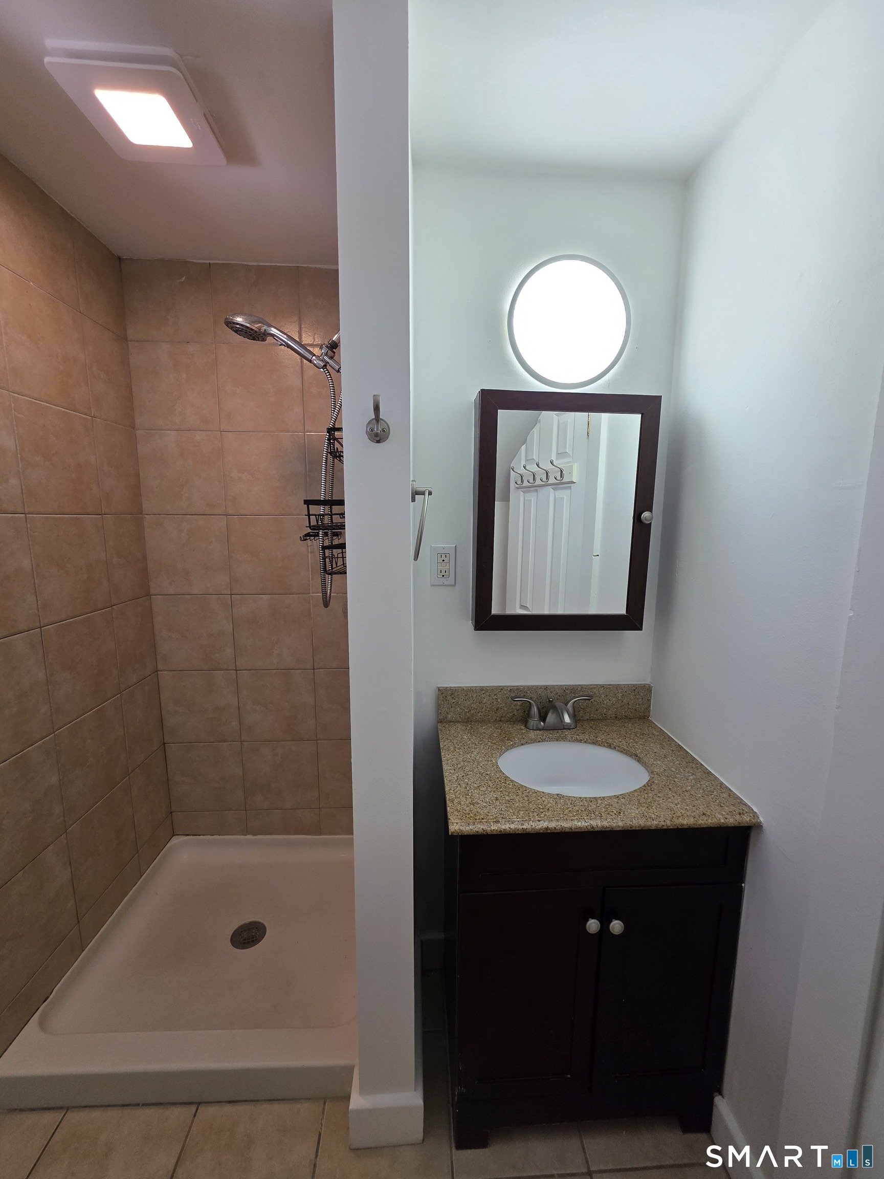 396 West Main Street, Unit 3 New Britain, CT 06052 - Photo 13 of 17 a bathroom with a sink and a mirror