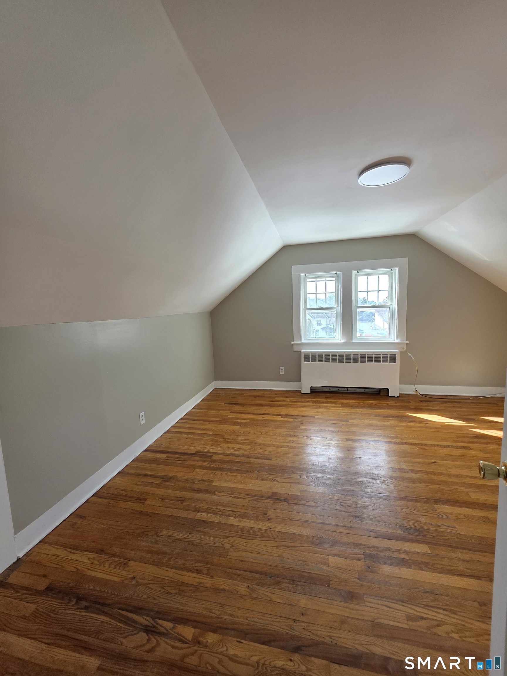396 West Main Street, Unit 3 New Britain, CT 06052 - Photo 6 of 17 a view of empty room with wooden floor and fan