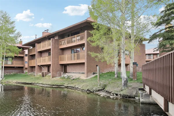 a house with river in front of it