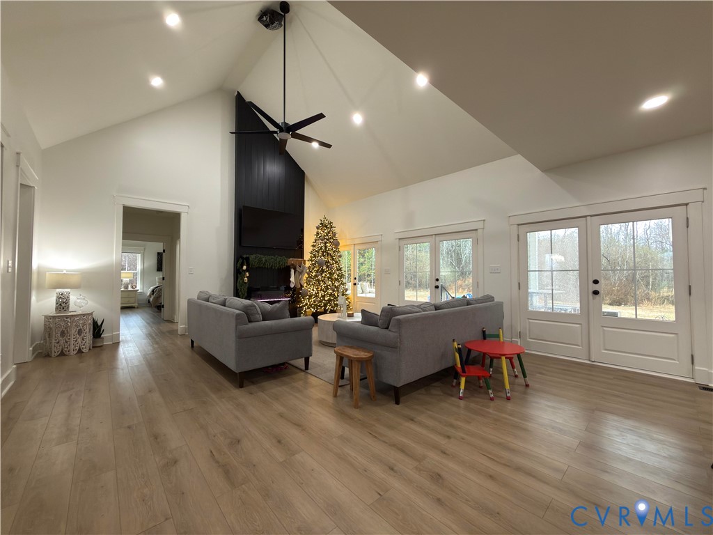 7017 Claiborne Road Sutherland, VA 23885 - Photo 21 of 62 a living room with furniture and a wooden floor