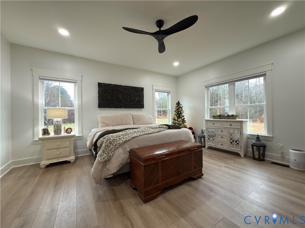 7017 Claiborne Road Sutherland, VA 23885 - Photo 31 of 62 a bedroom with a bed and a large window