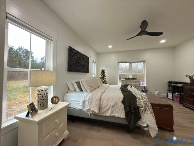 a spacious bathroom with a double vanity sink a mirror and a shower