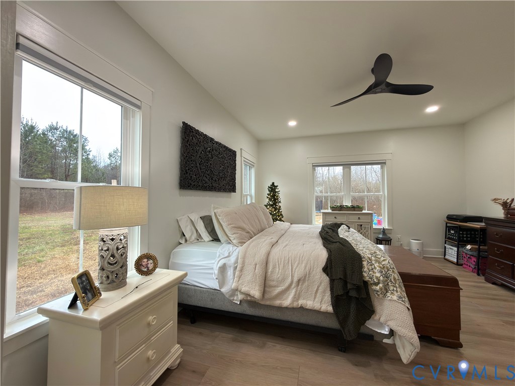 7017 Claiborne Road Sutherland, VA 23885 - Photo 32 of 62 a bedroom with a bed and a flat tv screen