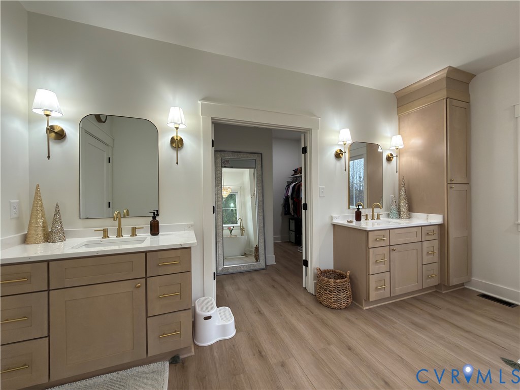 7017 Claiborne Road Sutherland, VA 23885 - Photo 33 of 62 a bathroom with a double vanity sink mirror and toilet