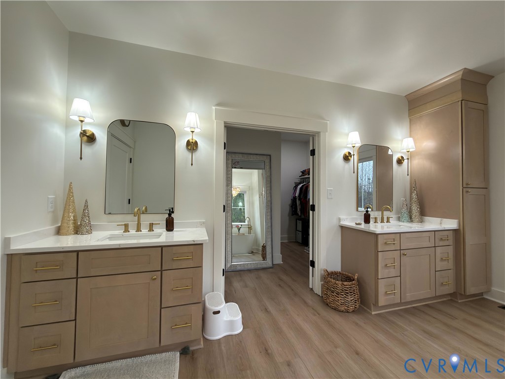 7017 Claiborne Road Sutherland, VA 23885 - Photo 34 of 62 a spacious bathroom with a double vanity sink double and mirror