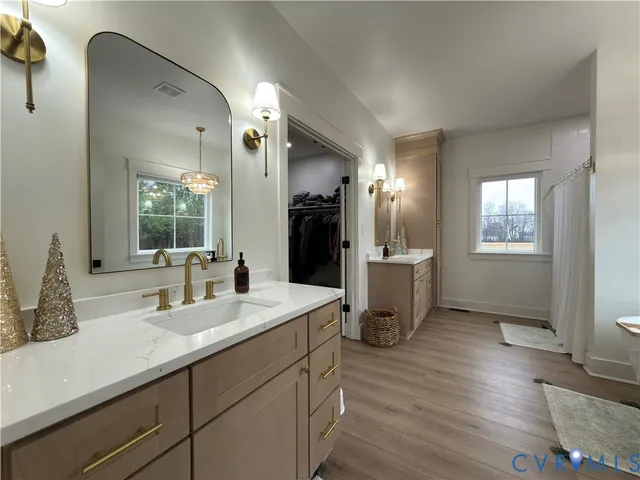 a bed sitting in a room next to a window