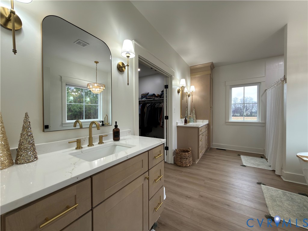 7017 Claiborne Road Sutherland, VA 23885 - Photo 35 of 62 a bathroom with a sink and a mirror