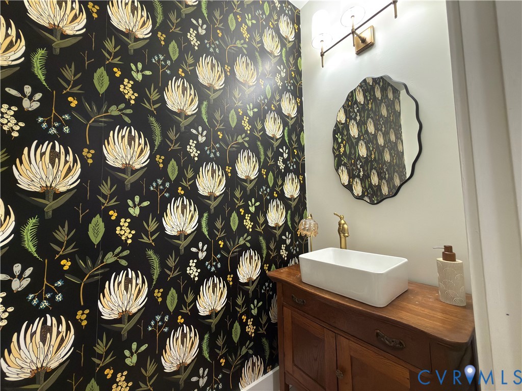 7017 Claiborne Road Sutherland, VA 23885 - Photo 47 of 62 a bathroom with a sink and mirror with toilet