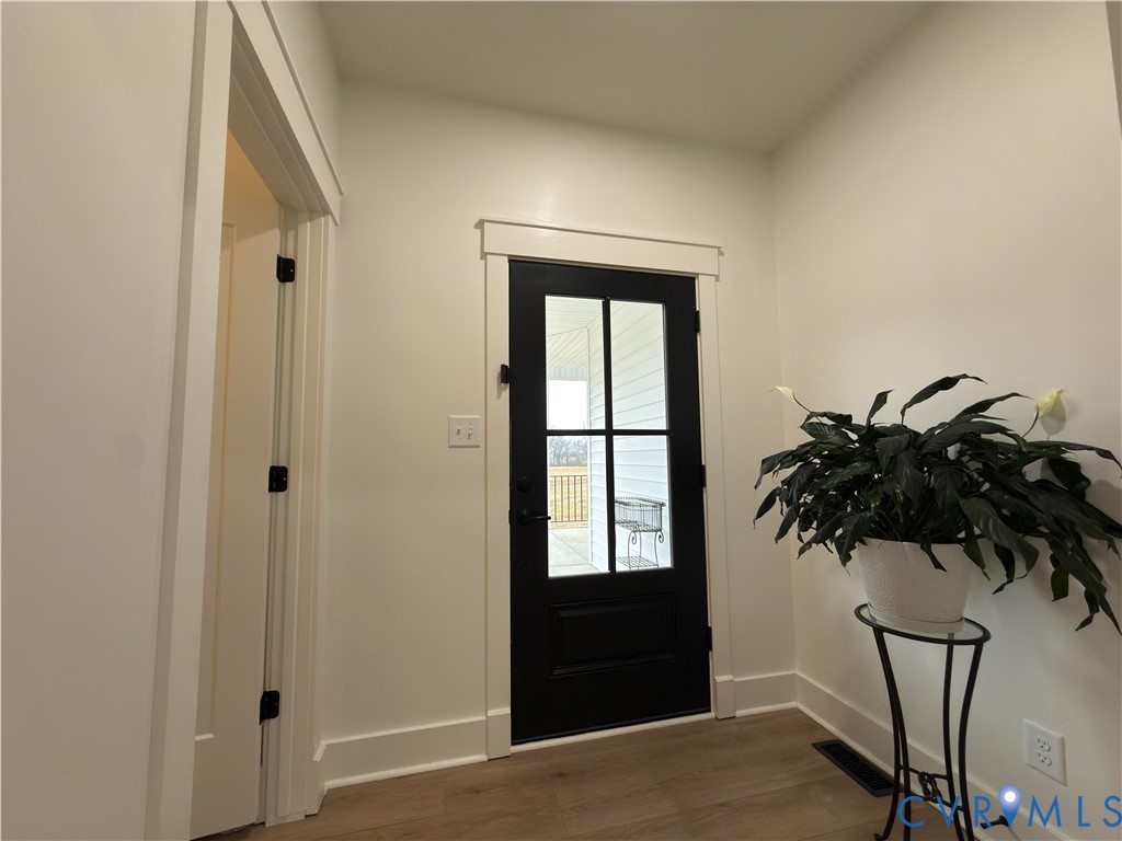 7017 Claiborne Road Sutherland, VA 23885 - Photo 52 of 62 a view of front door with a potted plant