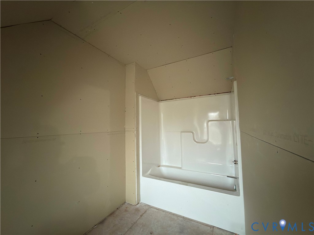 7017 Claiborne Road Sutherland, VA 23885 - Photo 55 of 62 a bathroom with a glass shower door