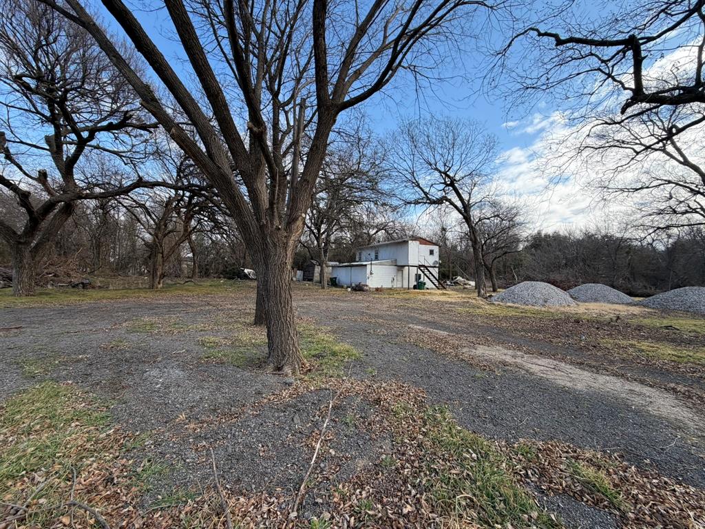 625 East Highway 199 Springtown, TX 76082 - Photo 4 of 13 a view of a yard with a tree