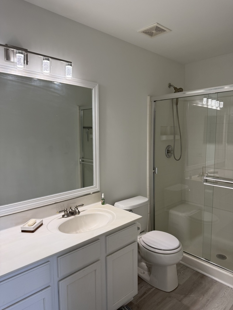 2522 Arcadia Circle Naperville, IL 60540 - Photo 13 of 18 a bathroom with a sink toilet and shower