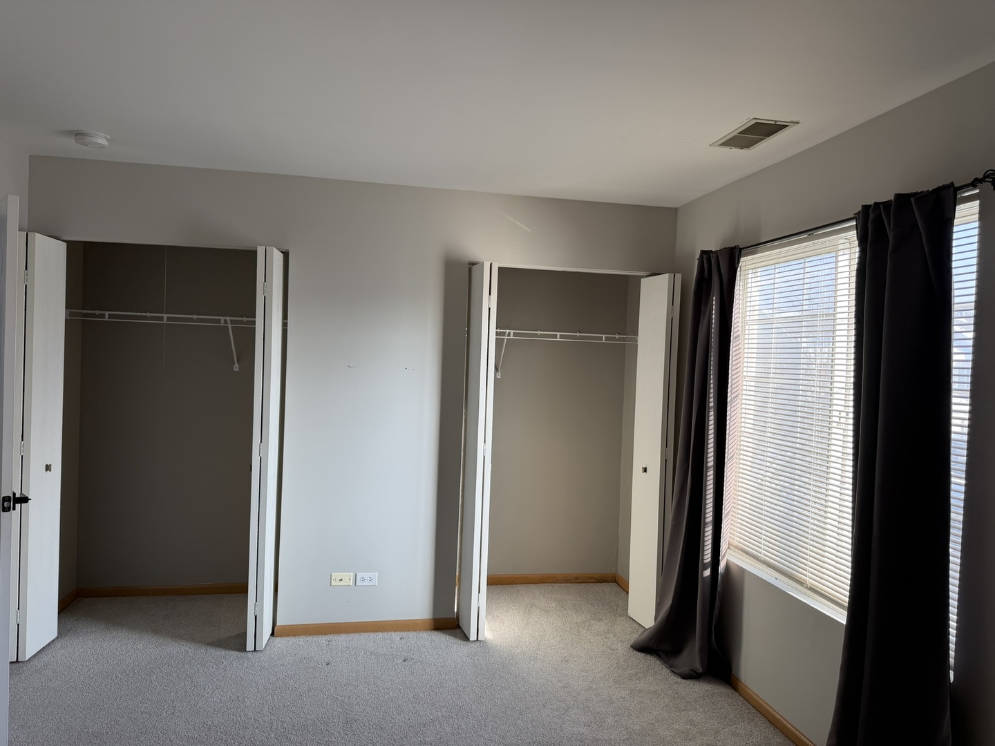 2522 Arcadia Circle Naperville, IL 60540 - Photo 16 of 18 an empty room with closet and a window