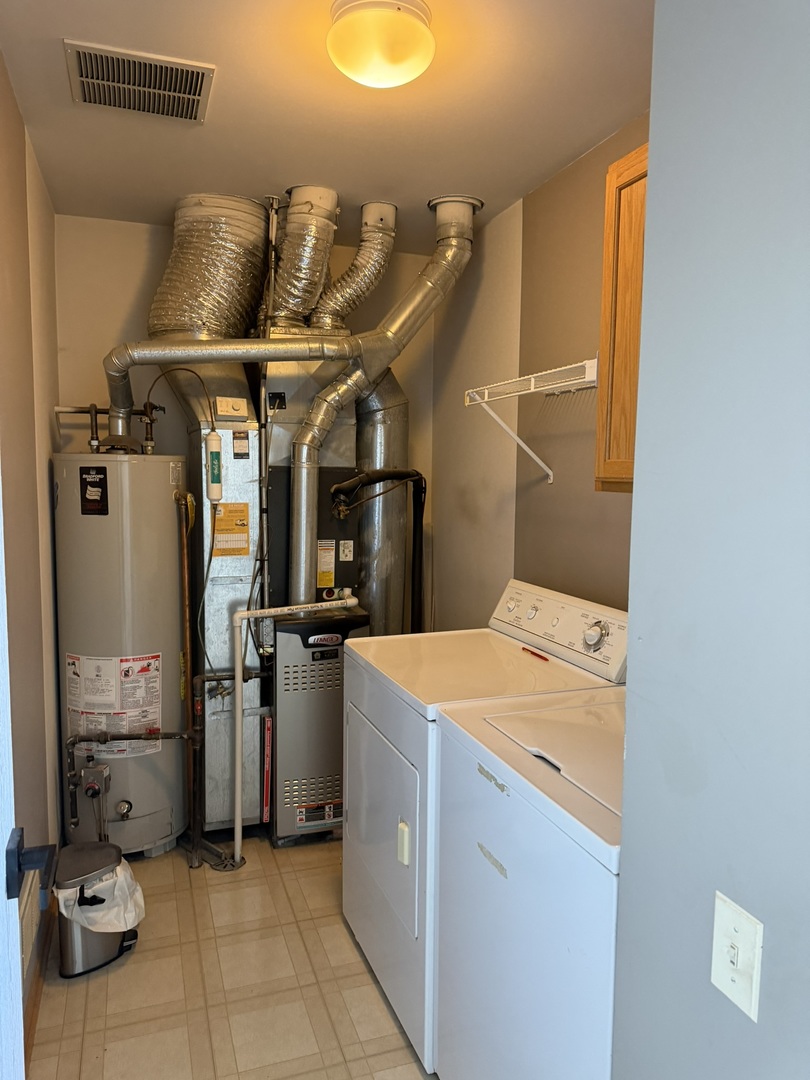 2522 Arcadia Circle Naperville, IL 60540 - Photo 17 of 18 a utility room with dryer and washer