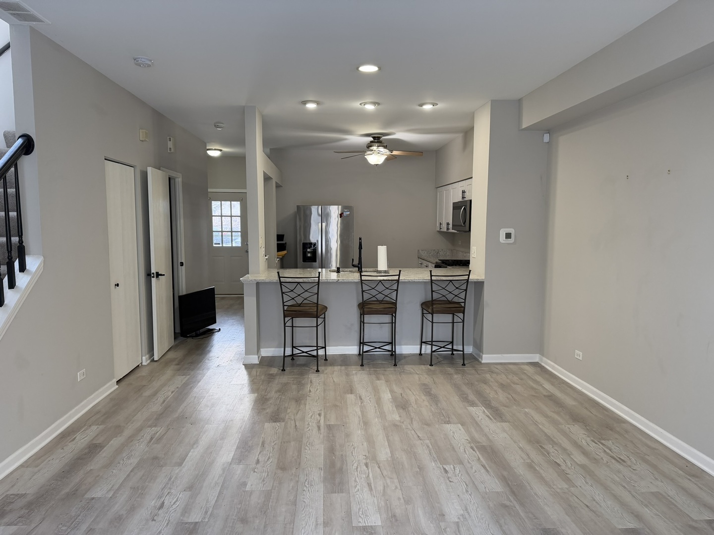 2522 Arcadia Circle Naperville, IL 60540 - Photo 6 of 18 a view of a kitchen with dining space and wooden floor