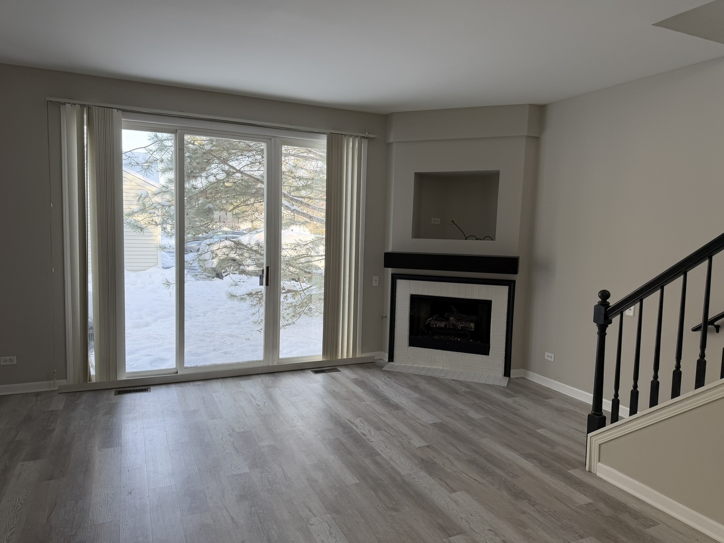 2522 Arcadia Circle Naperville, IL 60540 - Photo 8 of 18 a view of a livingroom with wooden floor a fireplace and window
