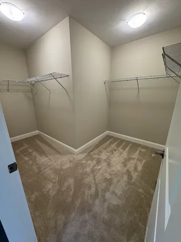 a view of a room with racks on the wall