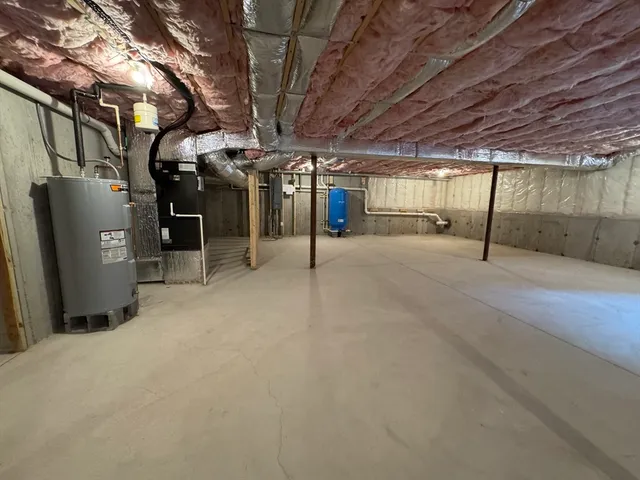 a view of empty room with wooden walls