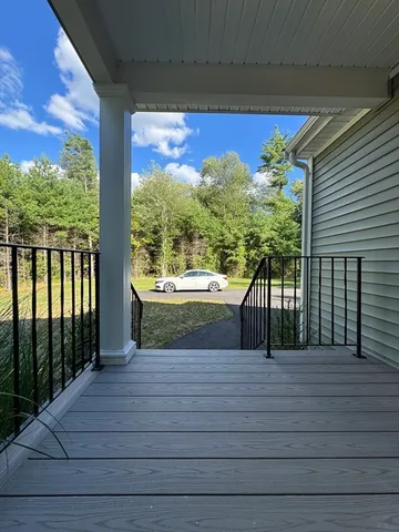 a view of a balcony with chairs