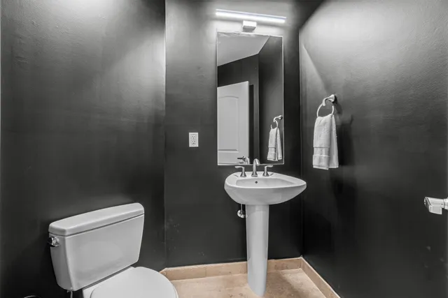 a kitchen with sink refrigerator and stove