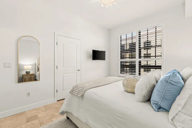 a bedroom with a bed and a couch