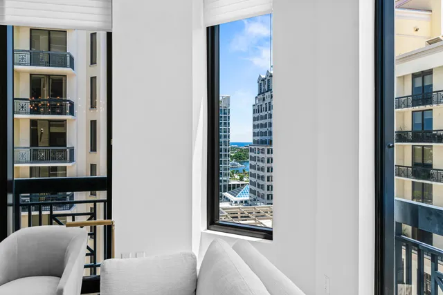 a dining room with furniture and a chandelier