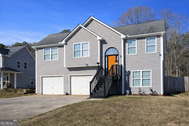 a front view of a house with a garage