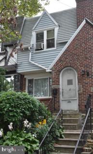32 Springton Road Upper Darby, PA 19082 - Photo 1 of 9 a front view of a house with a yard