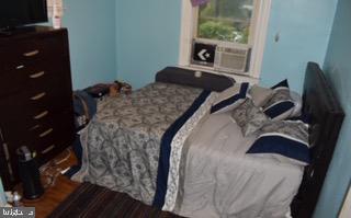 32 Springton Road Upper Darby, PA 19082 - Photo 6 of 9 a bedroom with a bed and a window