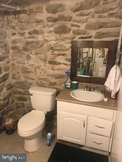 32 Springton Road Upper Darby, PA 19082 - Photo 9 of 9 a bathroom with a toilet sink and mirror