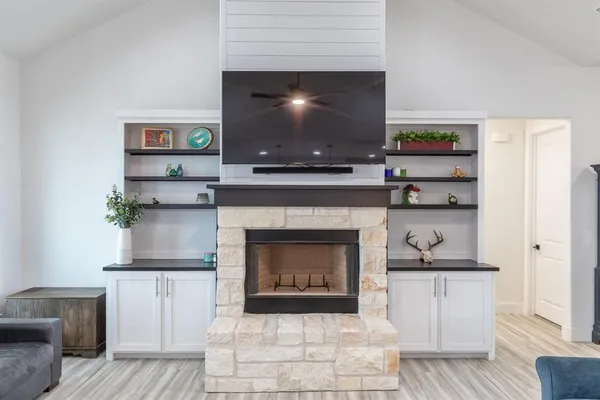 a living room with furniture and a fireplace