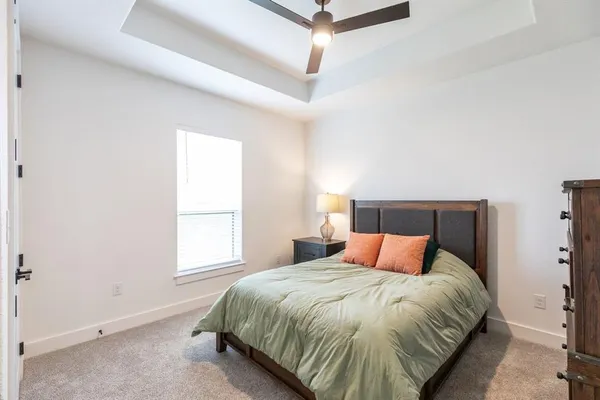 a bedroom with a bed and window