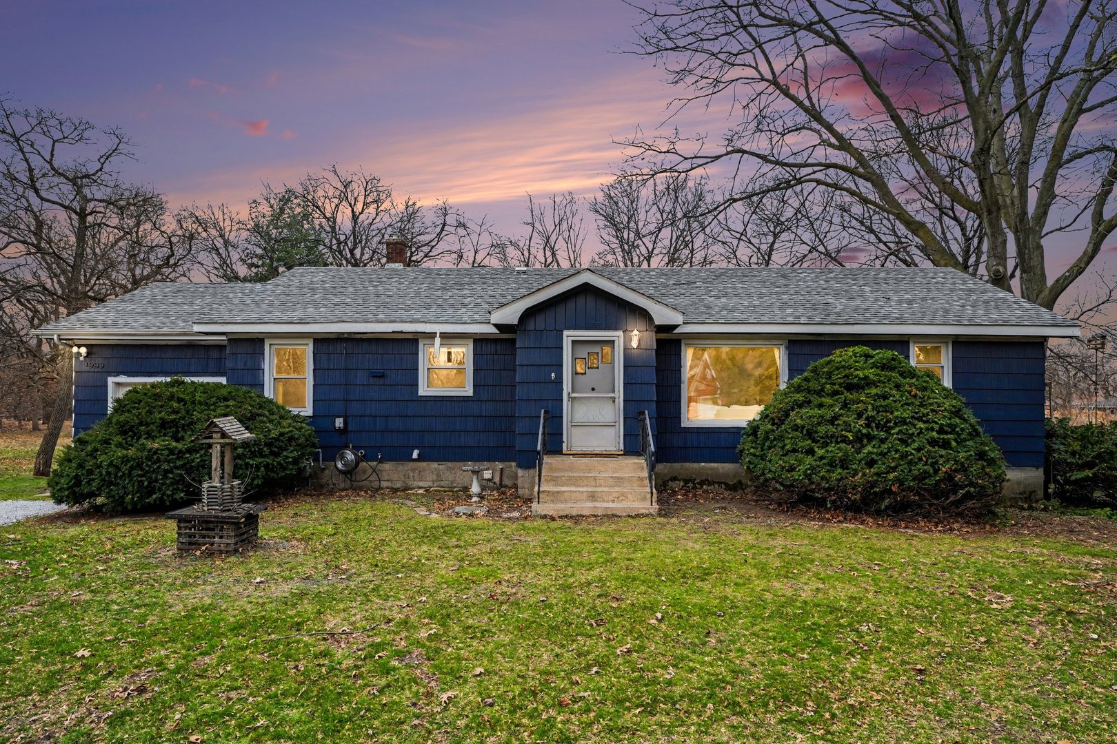 a front view of a house with garden