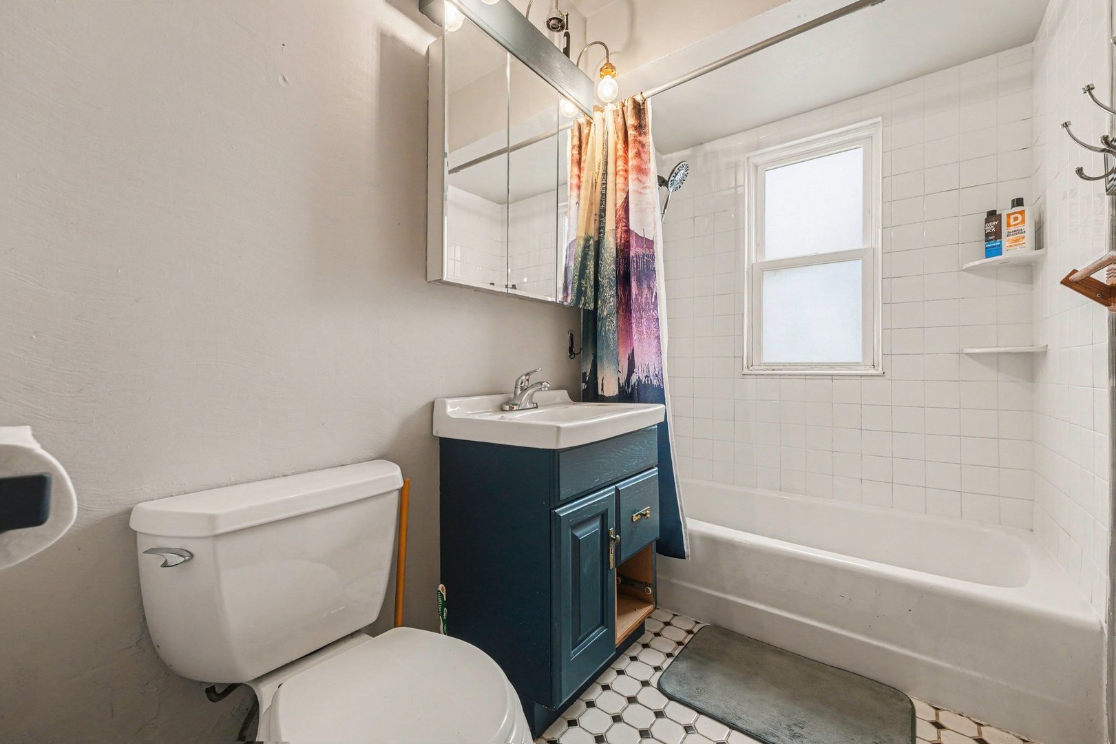 1999 Indiana Avenue Lansing, IL 60438 - Photo 12 of 18 a bathroom with a sink toilet and shower