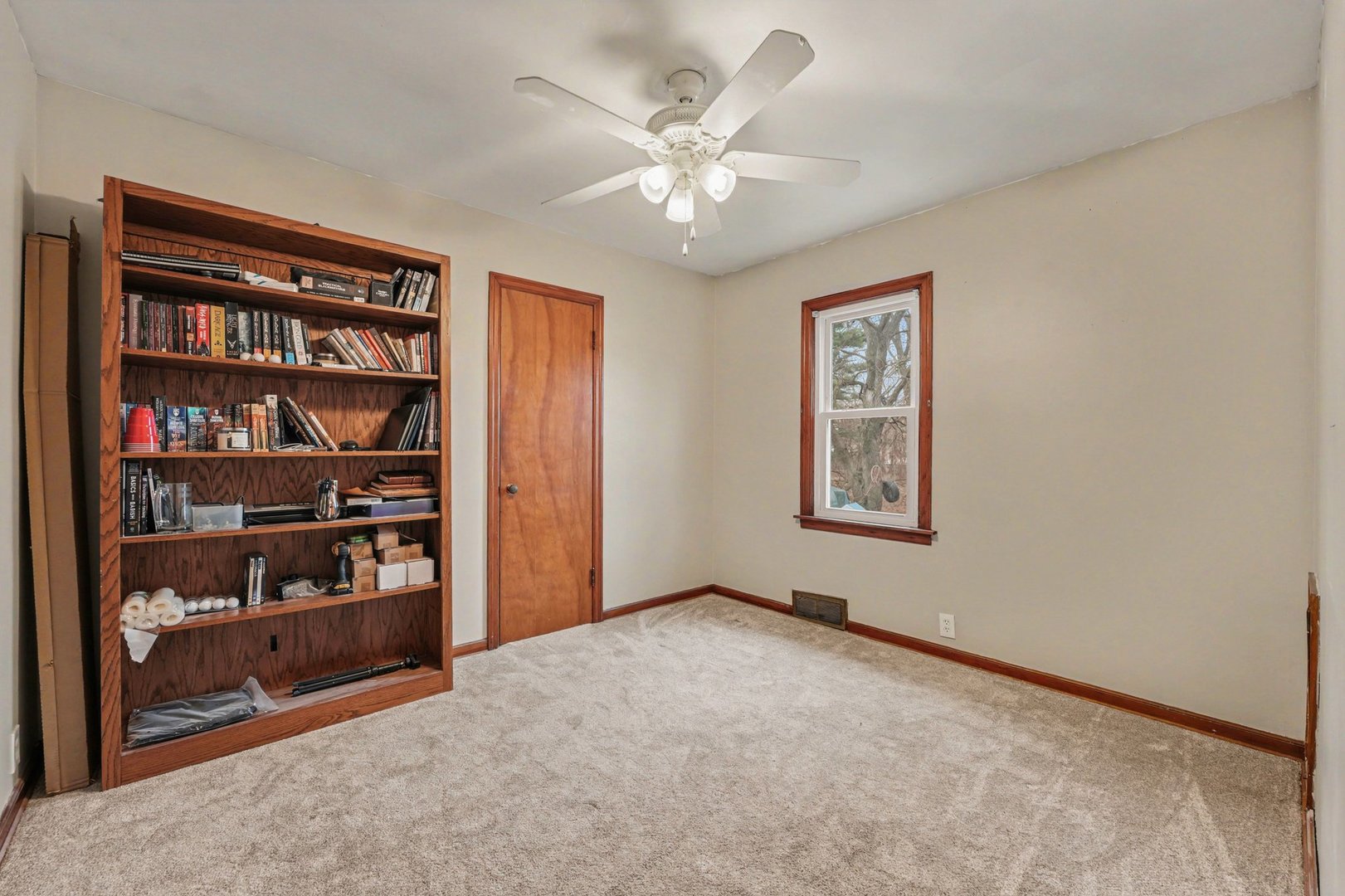 1999 Indiana Avenue Lansing, IL 60438 - Photo 10 of 18 a view of an empty room with cabinet and a ceiling fan
