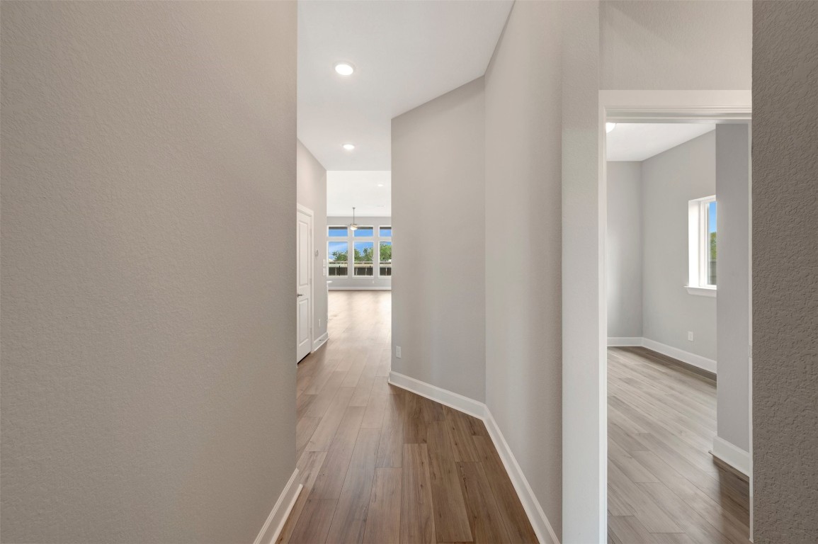 2423 Msn Hts Way Manvel, TX 77578 - Photo 13 of 49 a view of hallway with wooden floor