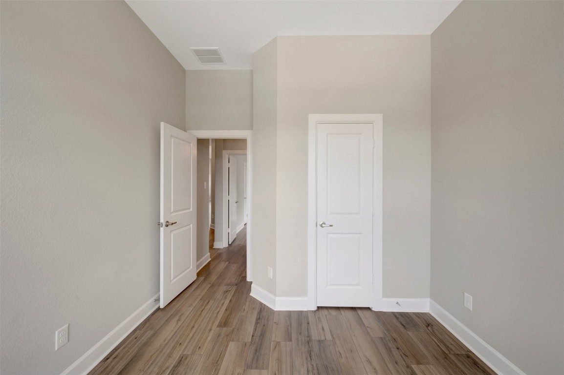 2423 Msn Hts Way Manvel, TX 77578 - Photo 15 of 49 a view of a hallway with wooden floor