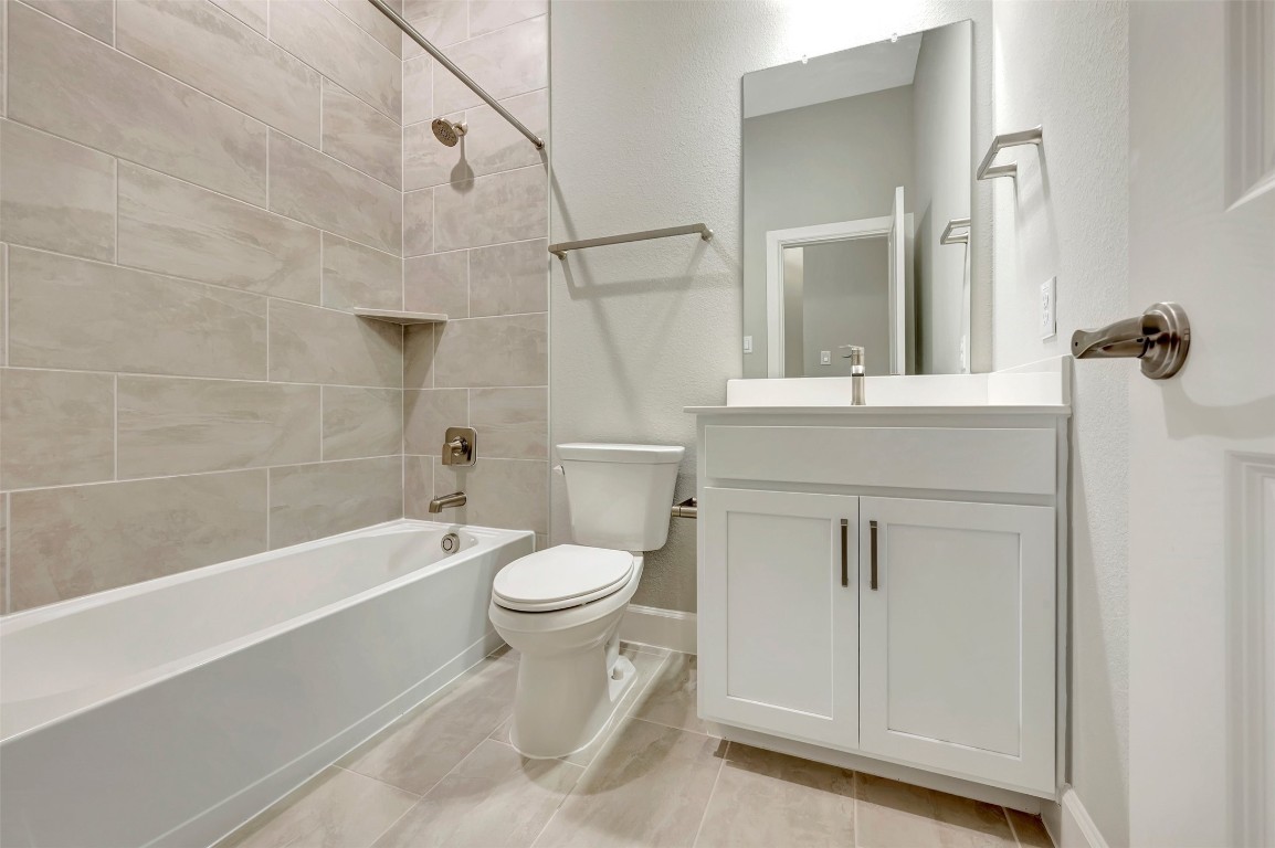 2423 Msn Hts Way Manvel, TX 77578 - Photo 16 of 49 a bathroom with a sink a toilet and a bathtub