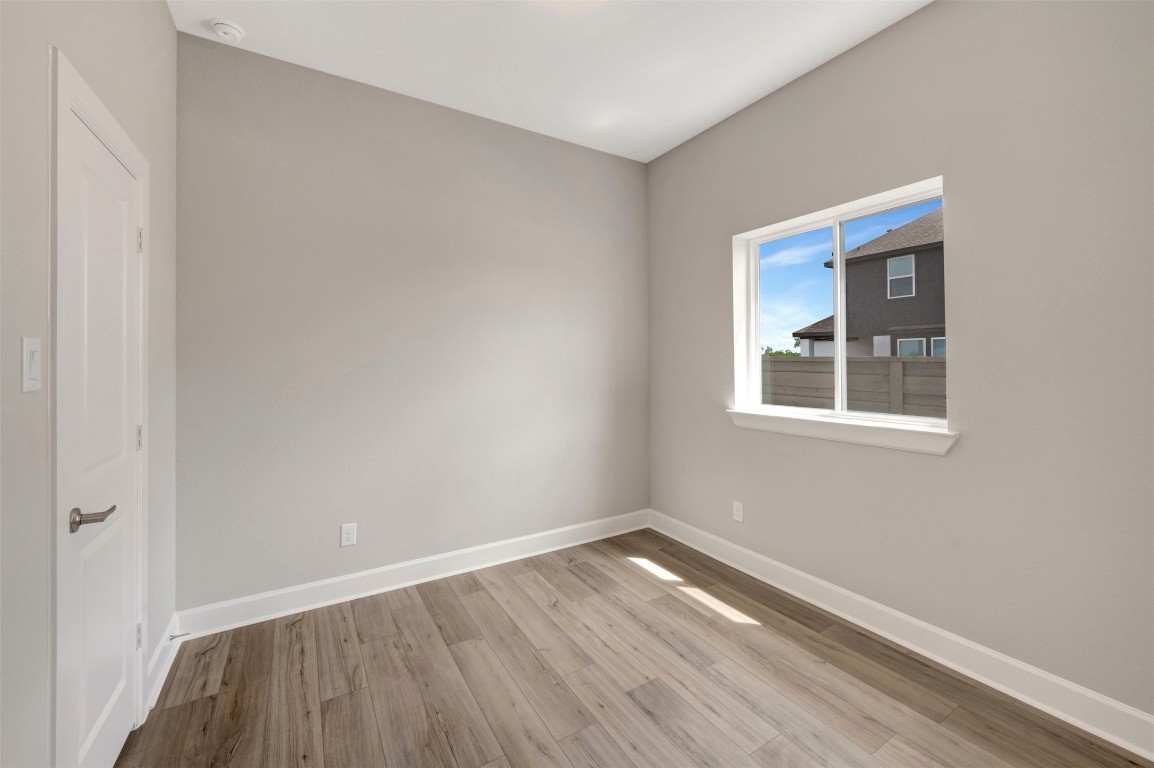 2423 Msn Hts Way Manvel, TX 77578 - Photo 17 of 49 a view of a room with wooden floor and windows