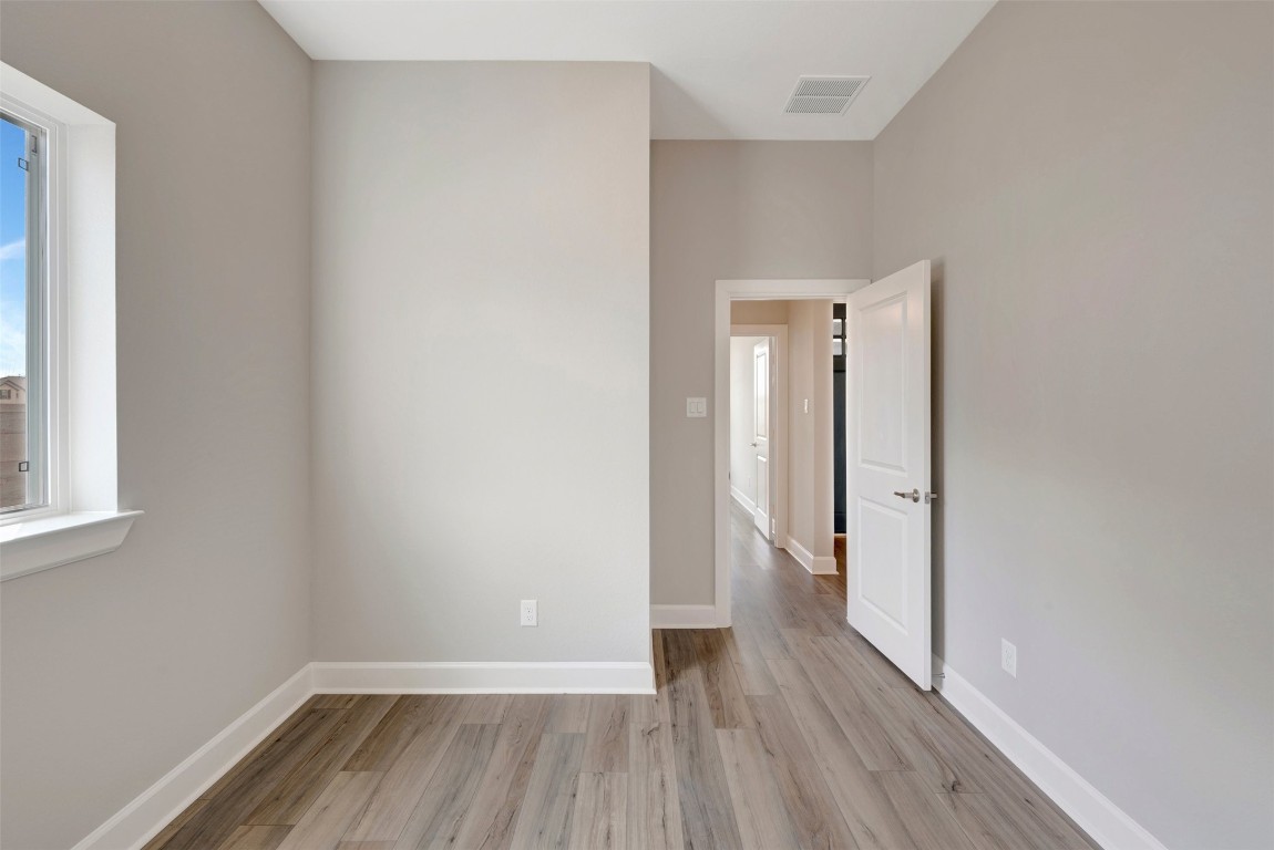 2423 Msn Hts Way Manvel, TX 77578 - Photo 18 of 49 a view of hallway with wooden floor