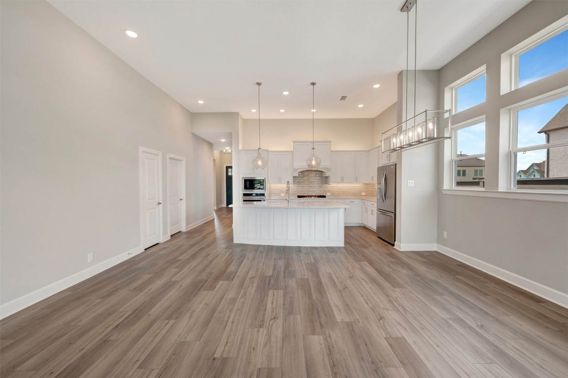 2423 Msn Hts Way Manvel, TX 77578 - Photo 32 of 49 a view of kitchen with wooden floor