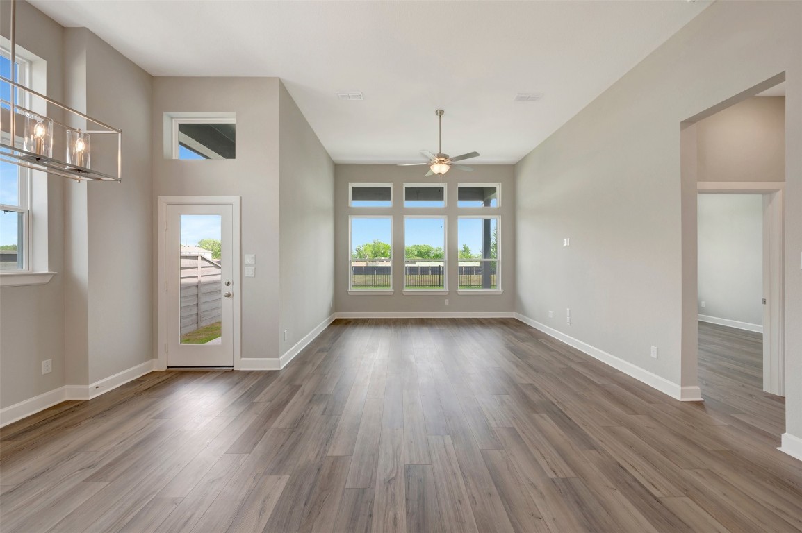 2423 Msn Hts Way Manvel, TX 77578 - Photo 33 of 49 an empty room with wooden floor and windows