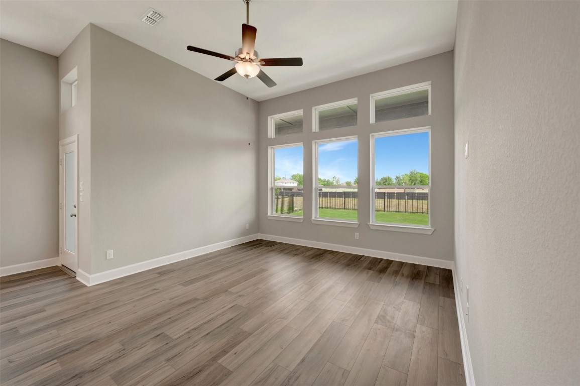 2423 Msn Hts Way Manvel, TX 77578 - Photo 34 of 49 a view of an empty room with wooden floor and a window